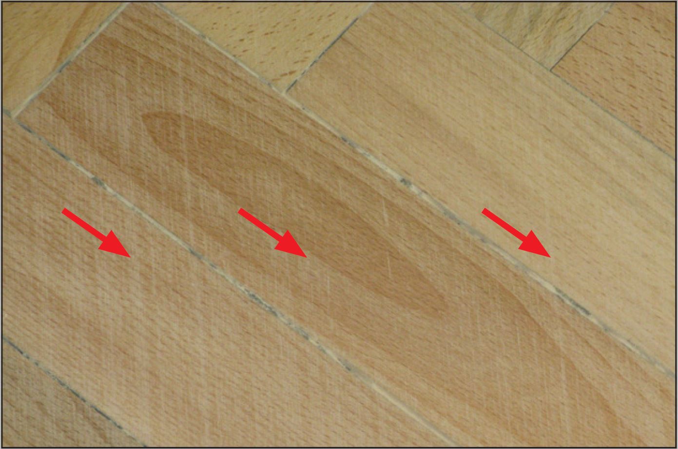 Wood Floor Streaks Caused by a Damaged Sanding Drum