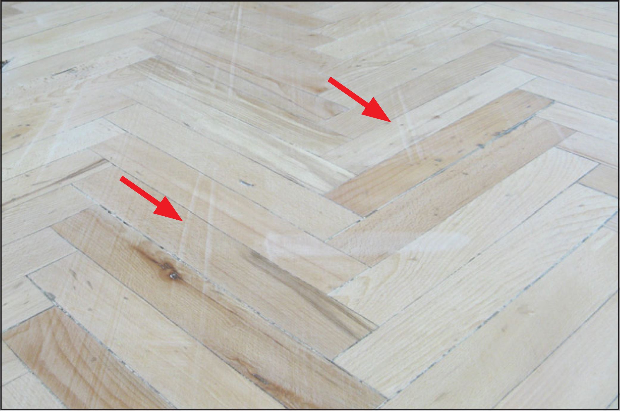 Gouges Cut in a Wood Floor by a Damaged Sanding Drum